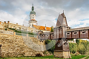 Old carved wooden Jurkovic bridge with charming castle tower in Nove Mesto nad Metuji, pearl of Eastern Bohemia, Czech Republic.