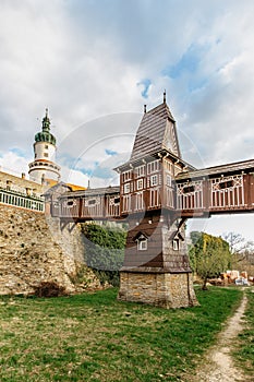 Old carved wooden Jurkovic bridge with charming castle tower in Nove Mesto nad Metuji, pearl of Eastern Bohemia, Czech Republic.
