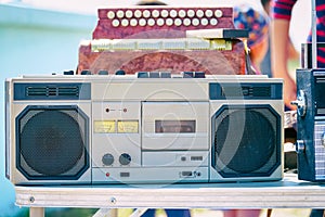 Old cassette recorder of silver color on table