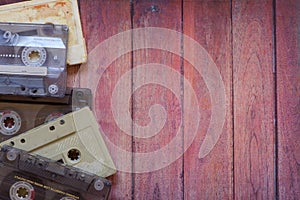 Old cassette tapes on the wooden table