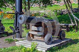 Old cast-iron cannon on a wooden carriage in the Karela fortress