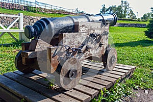 Old cast-iron cannon on a wooden carriage in the Karela fortress