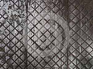 old cast iron factory floor tiles with checkered skid-proof pattern