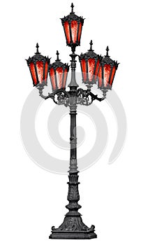 Old cast iron lamp post with red glass