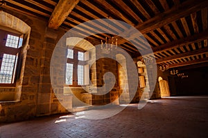 Old castle building interior with stone walls and wooden ceiling