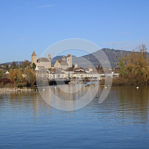 Old castle and church at the shore of Lake Zurich