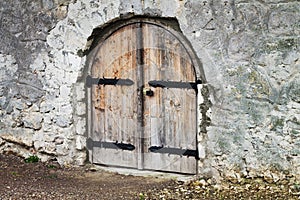 Old castle or church wooden arch door