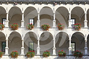 Old castle facade with arches and columns