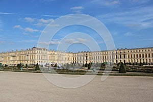 Old castle and its yard in Versailles Castle in Paris, France, fountain, flowers and garden