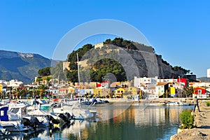 Old castle in a mediterranean city and the harbor