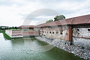 Old castle with moat in Holic, Slovakia, cultural heritage photo