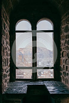 Old castle window overlooking the fortress, middle ages