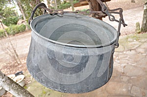 Old cauldron on chain