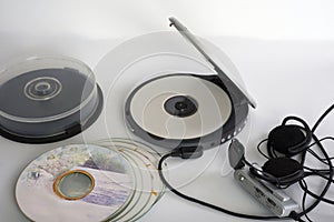 A old CD-Player with compact discs. White background. Studio shot