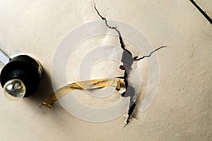 Old ceiling in a wooden house, damaged a huge hole in the roof from rainwater leakage. Selective focus