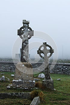 An old Celtic crosses wrapped in fog