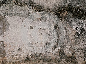 Old cement or concrete outdoor wall with stains and moldy for background.There are black and stains