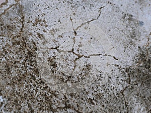 Old cement or concrete outdoor wall with stains and moldy for background.There are black and stains