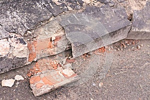 Old cement. Ruined bricks. Dark gray color