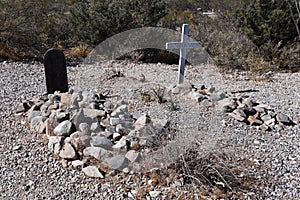 An old cemetery with graves covered with rocks know as boothill