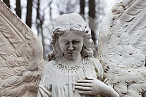 Old cemetery marble sculpture of the angel