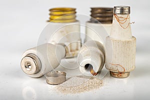 Old ceramic electric fuse. Blown and badly repaired security for energy