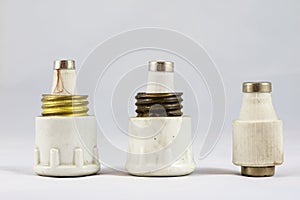 Old ceramic electric fuses on white isolated background