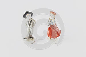 Old ceramic figurines on a white background