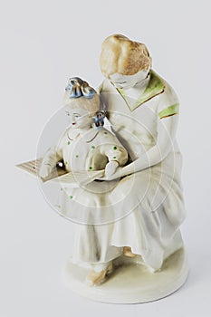 Old ceramic figurines on a white background