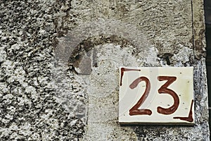 Old ceramic street number 23 decorative plate