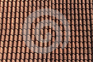 Old ceramic tile roof close up. background