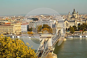 The old Chain Bridge of Budapest by autumn day.