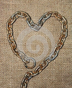 Old chain heart with jute cloth