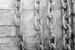 Old chain on wooden background