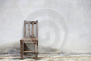 Old chair against old wall