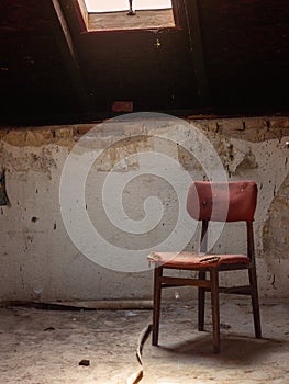 Old chair in rustic vintage style attic. Horror background concept