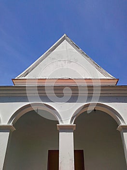 Old chapel in bright sky at Wat Thai temple , Songkhla , Thailand