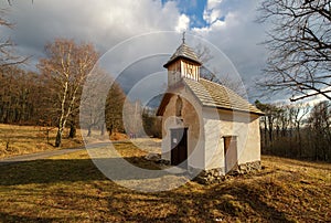Old abandoned small chapel in the middle of the woods. Wooden church tower, Tribec, Vrch hora, Velky Kliz, Slovakia.