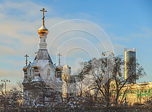 Old chapel in the middle of a winter city