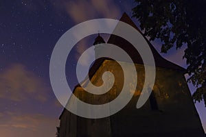 Old chapel in the village of Dobronice, under the night sky.