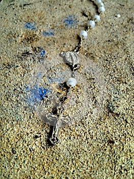 Old chaplet in the cement