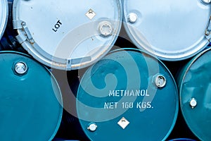 Old chemical barrels. Stack of blue methanol or methyl alcohol drum. Steel chemical tank. Toxic waste. Chemical barrel with toxic