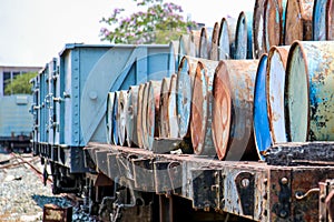 Old chemical tank and oil tank placed on the old train cargo wagon