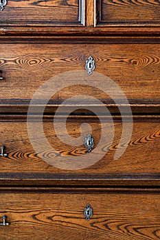 .old chest of drawers with handles and keyholes - Image