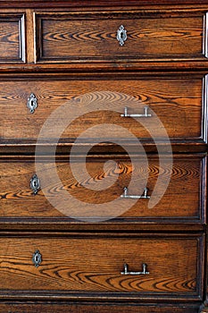 .old chest of drawers with handles and keyholes - Image