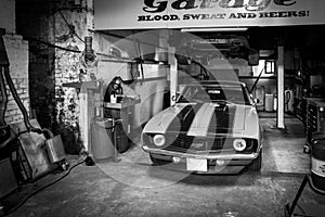 an old cheverolet stands in a workshop