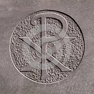 Old Chi-Rho sign (Christogram) carved with stone photo