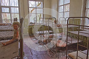 Old children`s beds in an abandoned kindergarten. The interior of a room in one of the buildings in the Chernobyl radioactive