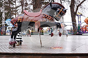 Russia. Penza. An empty horse on an old children`s carousel in the Park