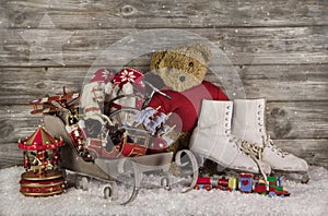 Old children toys on wooden background for christmas decoration.